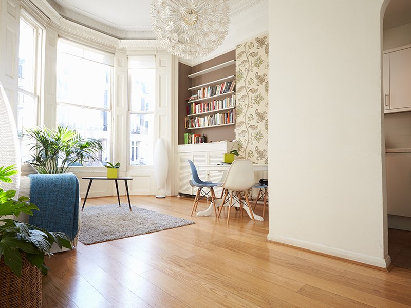 Meeting and Lounge Area with Hardwood floor and a white colourway